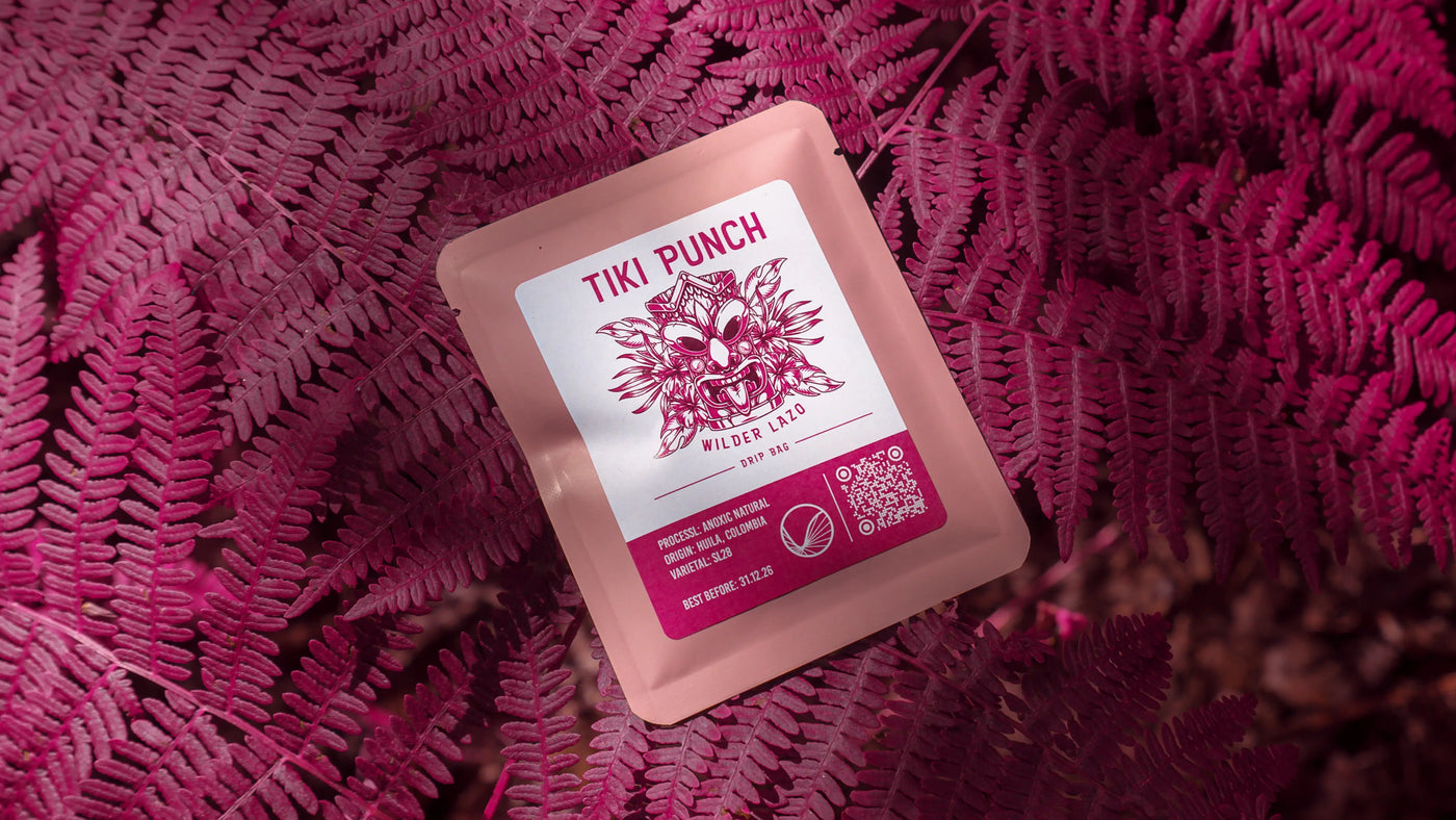 Coffee drip bag containing Wilder Lazo Tiki Punch, Colombia, on a pink background