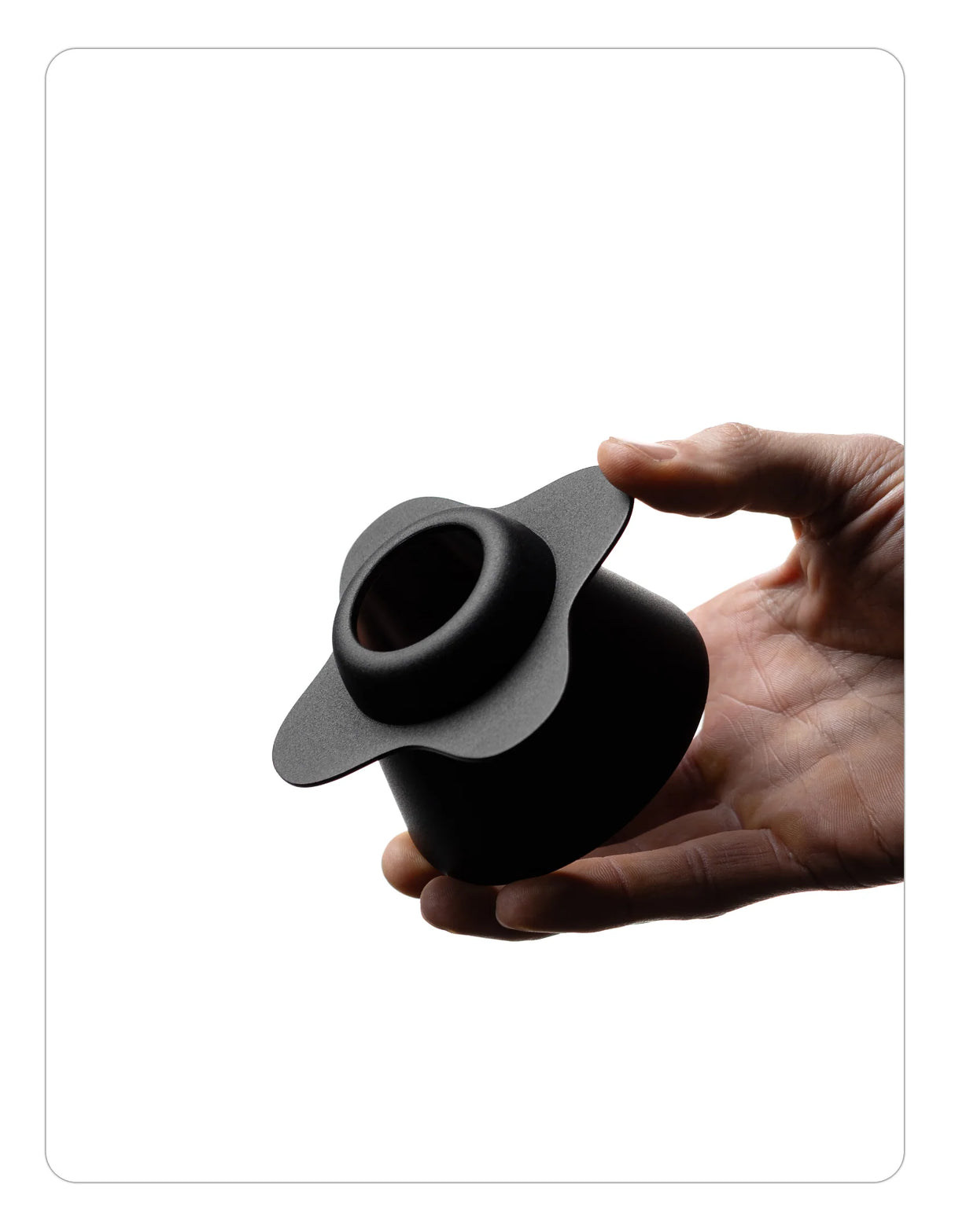 Hand holding a OREA 01 Obsidian coated steel brewer on a white background