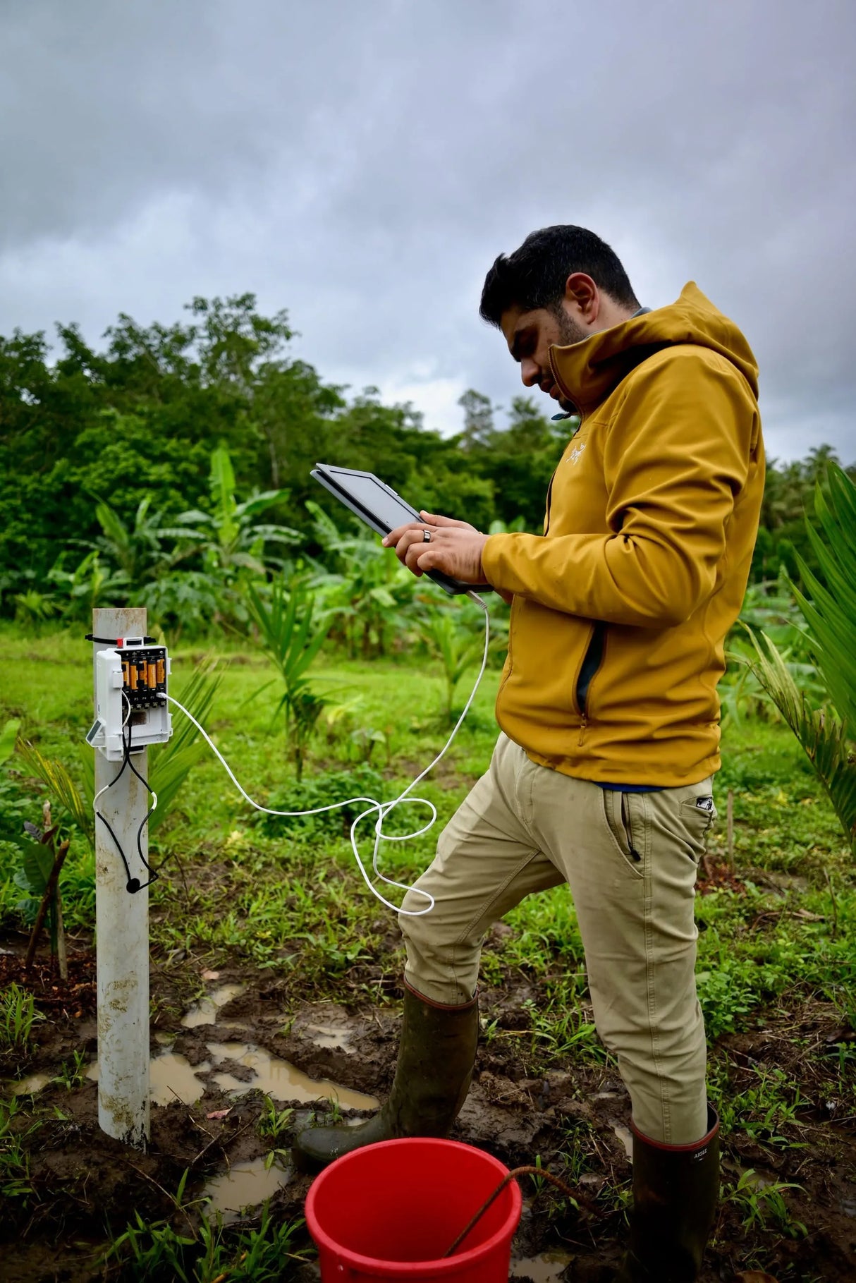Akshay Dashrath at Mooleh Manay, checking some technical details on the coffee farm