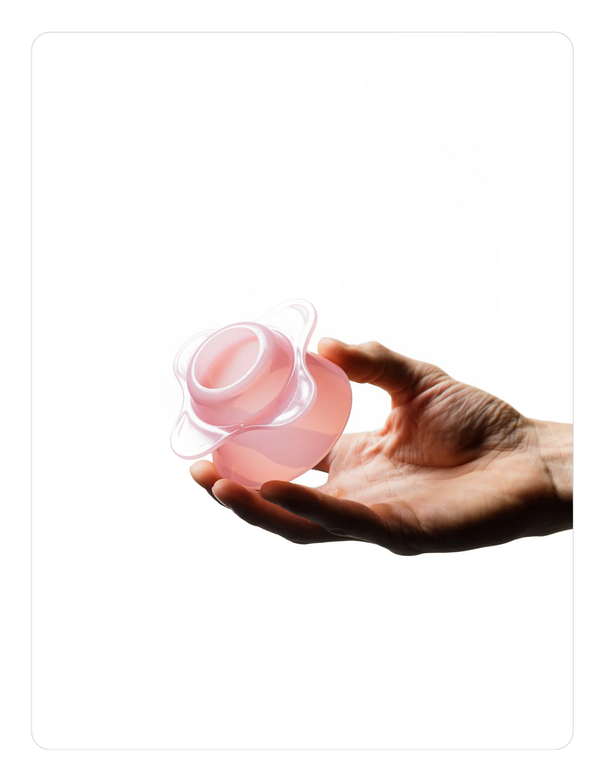 Hand holding a Creamy pink OREA 01 brewer against a white background